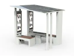 Salotto smart accessibile con copertura fotovoltaica, tavolo smart con ricarica wireless, panchina e panca accessibile in Strongplast, pannelli retroilluminati e illuminazione LED
